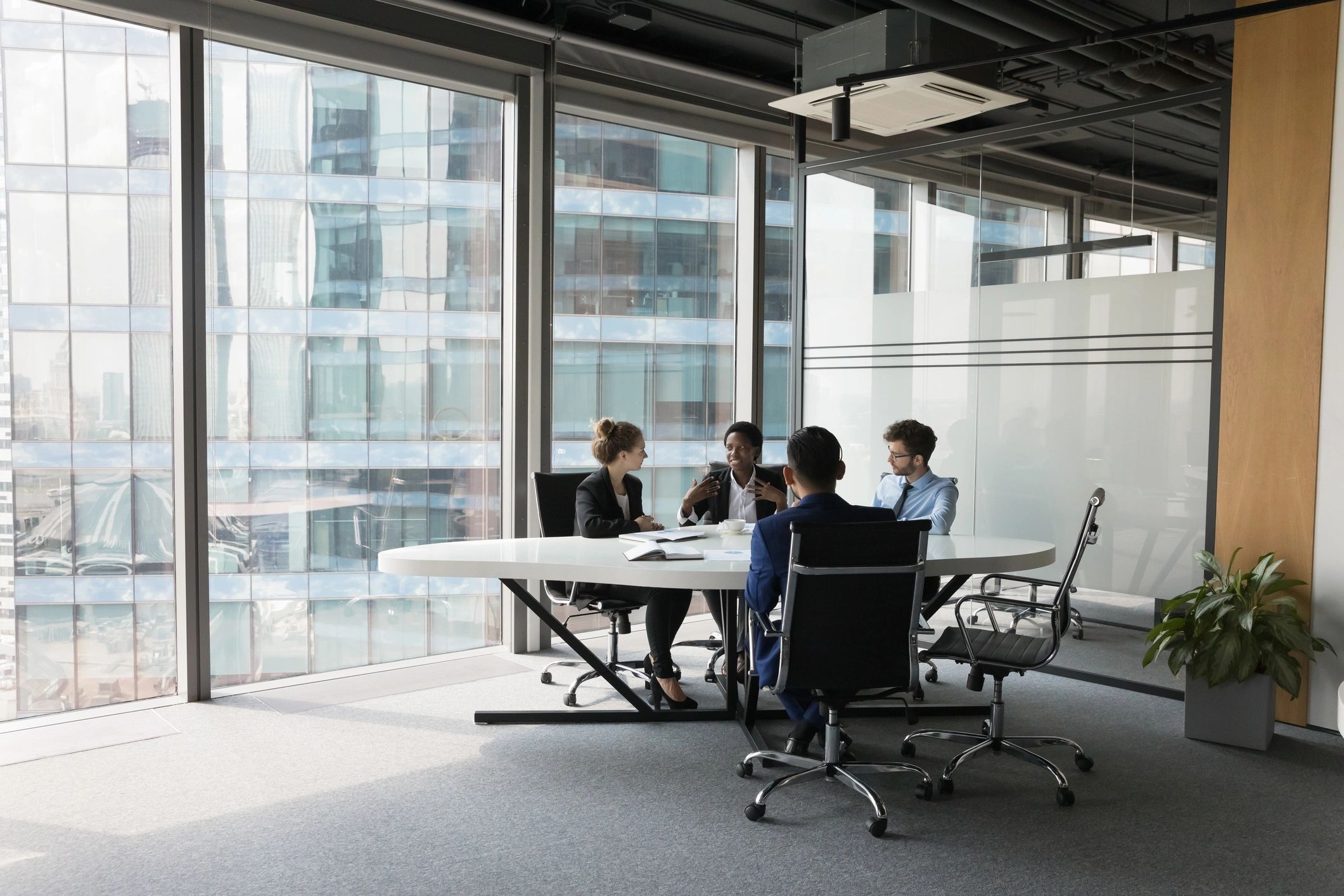 Business technology team meeting in a modern conference room
